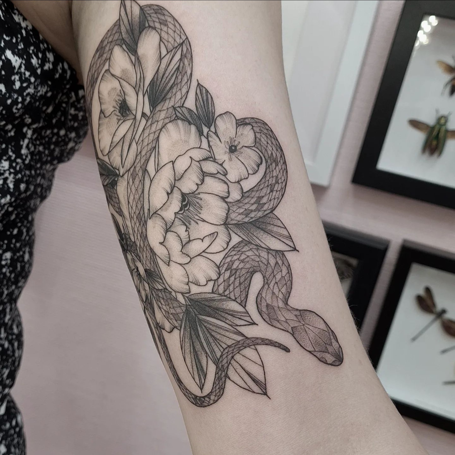 Snake and florals tattoo