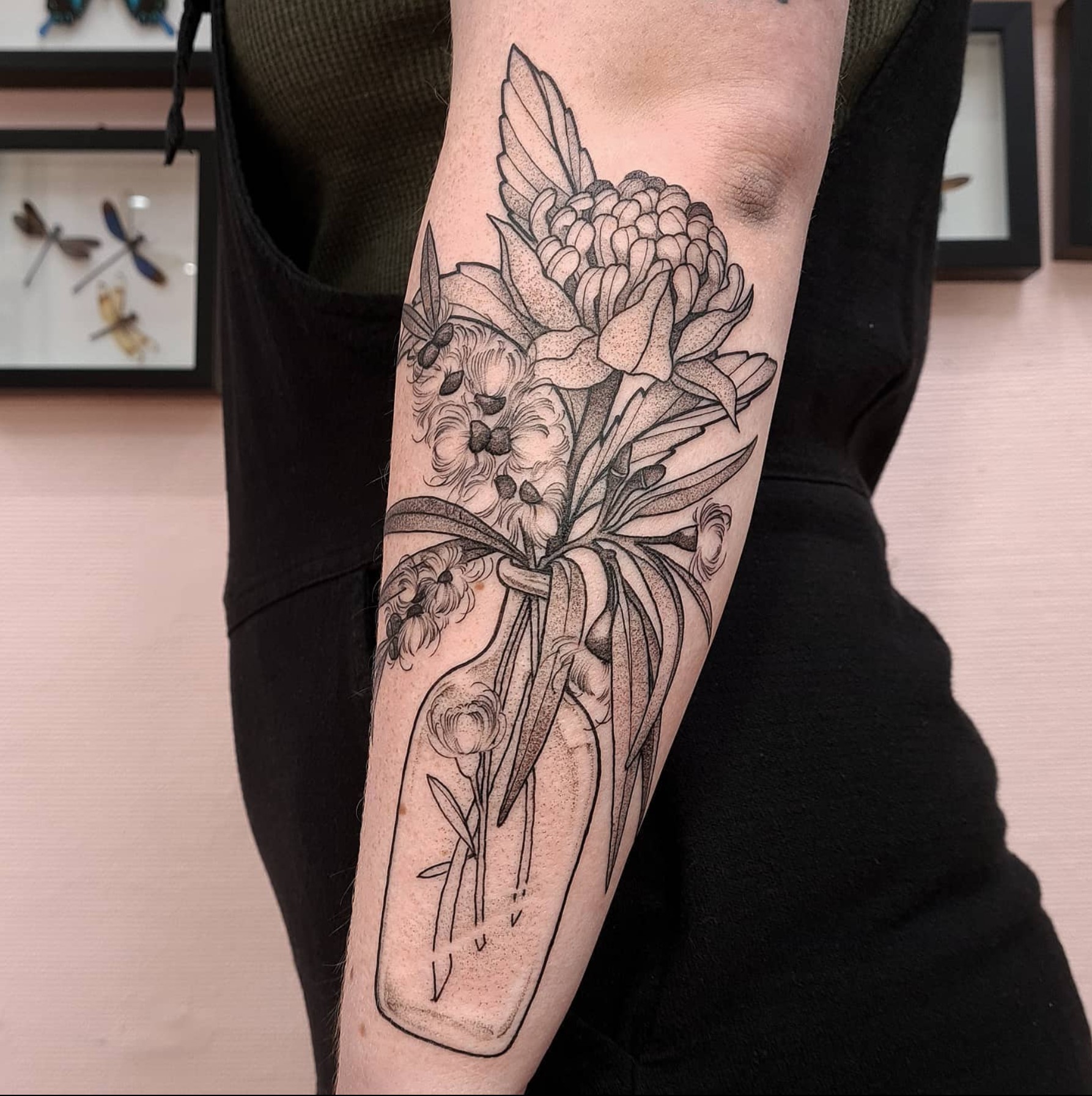 Florals in a vase tattoo
